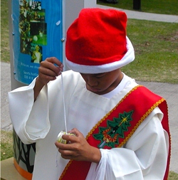 One young man contemplates the intricacies his Christmas present - a new yo-yo. How do I drive it?