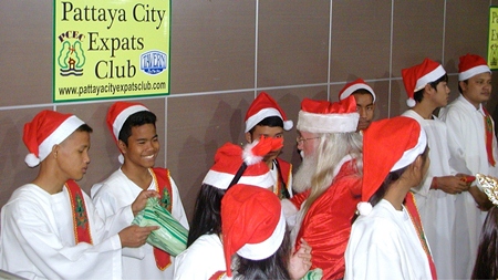 Saint Nicholas (in red cap) popped in to spread some cheer amongst the fine children of the orphanage. Pattaya City Expats Club congratulates Toy and her staff for the great work done with these formerly underprivileged children.