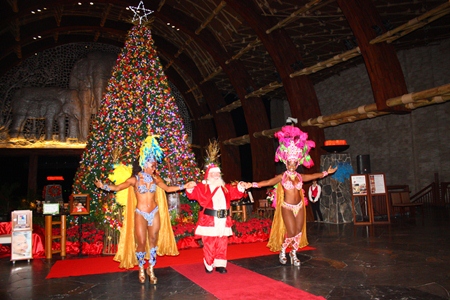 Santa with a twist - dancing with a pair of Samba dancers during the opening ceremony. 