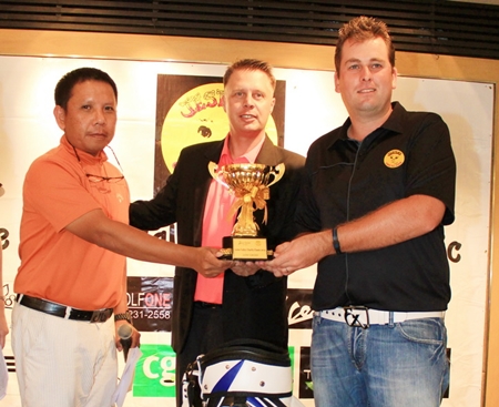Mike Moir (right) receives the Low Gross trophy after shooting a bogey-free 70. 