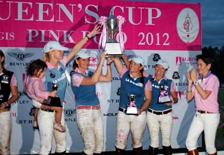 La Boheme hold up the trophy after winning the 2012 Pink Polo tournament at Thai Polo Club.