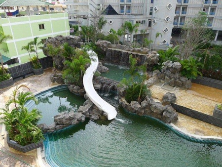 The Cliff project features a huge swimming pool, waterfall and outdoor landscaping. 