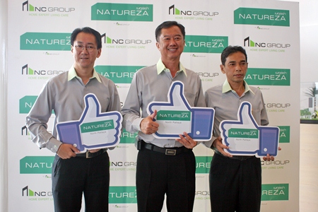 Somchao Tanthatherdthum, Managing Director of N.C. Housing Public Company Limited (center) poses with fellow Directors Somnuk Tanthatherdthum (left) and Rangsankh Nathakawong (right) at a press conference held Jan. 16.