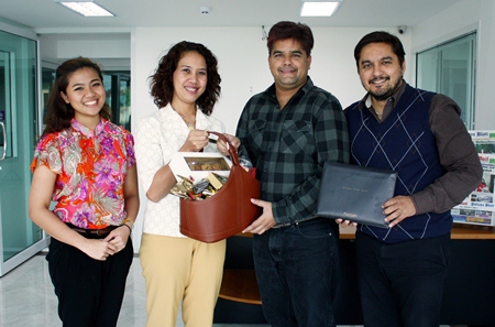 Usa Pookpant (2nd left), Public Relations Manager, and Naruechon Petlek (left), Public Relations Executive, represented the Centara Grand Mirage Beach Resort Pattaya in presenting New Year greetings to Tony and Prince Malhotra, directors of the Pattaya Mail Media Group recently.