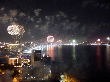 Pattaya Bay is lit up with fireworks, as seen from the top of the Cape Dara Hotel. (Photo by Peter Malhotra) 