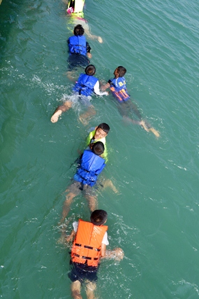 The children learn to ‘toe the line’.