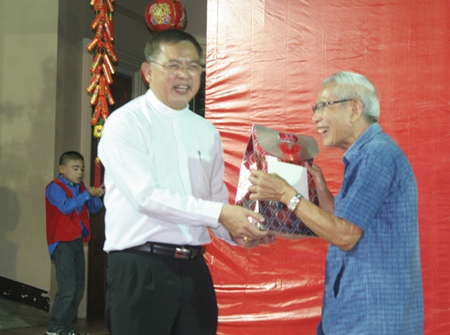 Bishop Silvio (left) honors Rev. Joseph Yuttichai Panchasap (right) for his 50th year in the priesthood. 