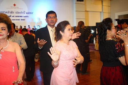 During her last night as Red Cross president, Nuanjan Saeng-Uthai (center) dances with husband Chaowalit, who took over the Chonburi Permanent Secretary post earlier this month.