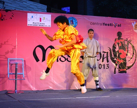 Hi ya! Another student takes to the air during his Kung Fu performance.