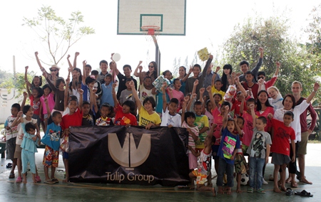 Children at the Child Protection and Development Center in Huay Yai say thank you to property developer Tulip Group for the lunch and games they brought to the children.