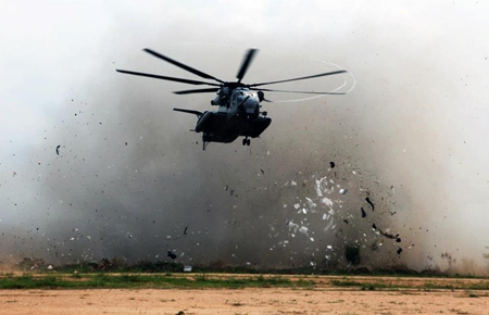 A U.S. Marine Corps CH-53E Super Stallion helicopter prepares to touch down to transport evacuees of a multinational emergency evacuation drill Feb. 17 in Pattaya, during exercise Cobra Gold 2013. (130217-M-IM838-056)