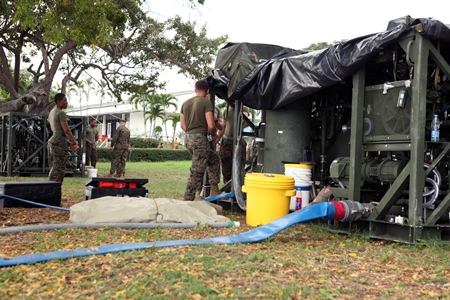 U.S. Marines from 3rd Marine Logistics Group operate a water purification system Feb. 10 in Sattahip, to provide clean water to multinational participants at various locations throughout Thailand during exercise Cobra Gold 2013. (Photo by Pfc. Mike Granahan)