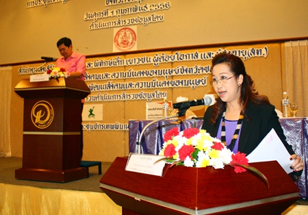 Suphatcha Suthipol, director of the Bureau of Child Promotion and Protection, with Chonburi Deputy Gov. Pornchai Khwansakul presiding in the background, addresses the meeting to improve child protection in Chonburi.