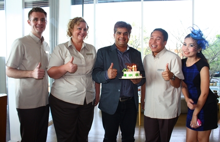 Tony Malhotra, Director of Business Development of the Pattaya Mail Media Group was feted by all his friends around town on the occasion of his birthday last week. The Hilton Pattaya had him for afternoon tea where (l-r) Simon Bender F&B director, Peta Ruiter, Director of Business Development, Dhaninrat Klinhom, Marketing and Communications Director and Senior Sales Manager presented him with a birthday cake. Back at the Pattaya Mail office, his he was met by Rungratree Thongsai (right), Public Relations Technical Officer at Pattaya City who together with the staff wish him a happy birthday with yet another delicious cake.