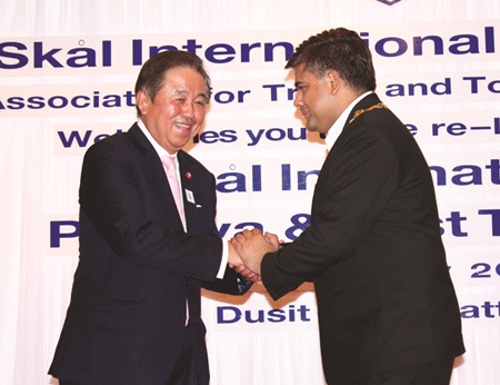 Senator Sutham Phanthusak congratulates President Tony Malhotra.