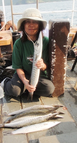 Nat holds up one of the plentiful barracuda.