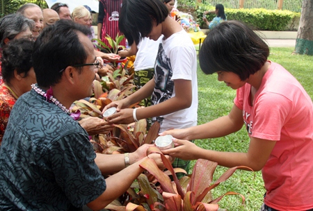 Pouring water over the hands of the elders is an important part of the ceremony.