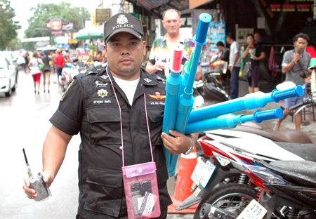 Police had the unpopular task of rounding up PVC water cannons early in the Songkran week, as can be seen by the sour faces in the background.