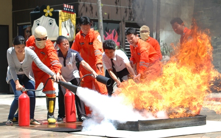 Employees at the mall are taught how to use fire extinguishers during Central Festival Pattaya Beach’s quarterly fire drill.