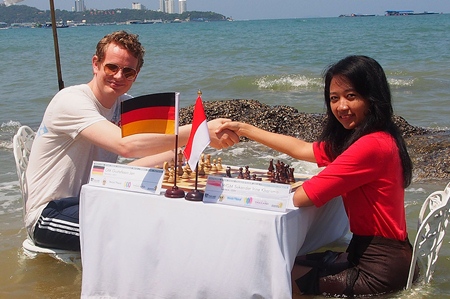 Germany’s Jan Gustafsson (left) cools off in the sea with Grandmaster Irine Sukandar of Indonesia.