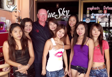 Winner Dan ‘the Man’ poses with the staff at Blue Sky Bar.
