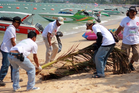 Neighborhoods looking better: Tune Hotel Pattaya staff remove litter and debris from Pattaya’s beach front.