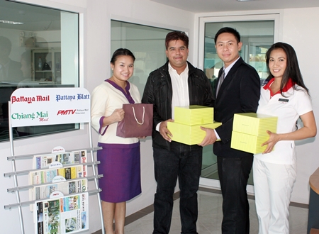 Assistant Spa Manager Nuradee Ruangchaipramote (left), Public Relations Executive Arwuth Tiampakdee (2nd right), and Fitness Manager Panthip Pongkio (right), of Dusit Thani Pattaya congratulate Suwanthep ‘Tony’ Malhotra (2nd left), deputy managing director of the Pattaya Mail Media Group on our move to the new offices combined with best wishes for the Thai new year.