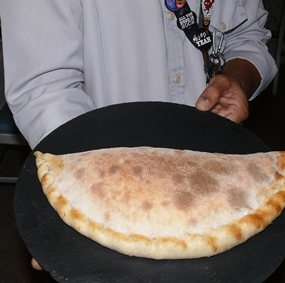 Surapat suggested we try his calzone, which was served on a black slate plate and had ricotta, prosciutto ham, pecorino cheese and spinach as the filling.