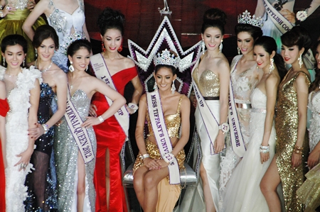 Contestants crowd around the newly crowned Miss Tiffany Universe 2013.