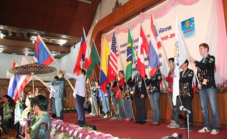 Youth Exchange students carry international flags at the opening ceremony.