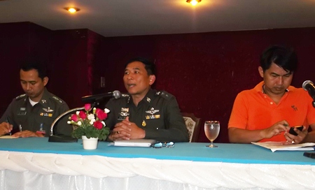 Col. Chatchawan Pisuthwong (center) lays out policies on morality and service for his officers.