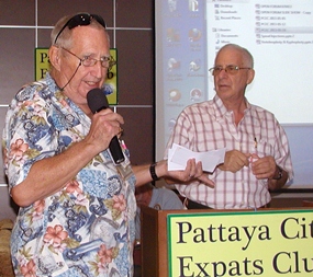 Back by popular demand after a short stint of R & R, ‘Hawaii Bob’ Sutterfield starts the meeting by conducting the Frugal Freddy drawing of specials at Pattaya’s many value & quality restaurants.