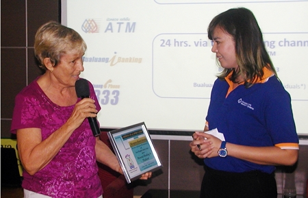 Waraporn Brand-Srinaka, Senior Sales & Marketing Specialist, Foreign Customer Segments provided information about Bangkok Bank products and services available to foreigners. Here she receives a Certificate of Appreciation for the Banks informative presentation.