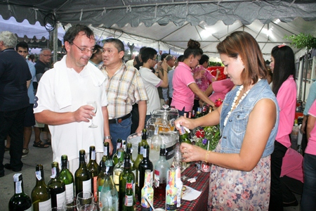 Wine representatives give out samples of wine to loyal customers.