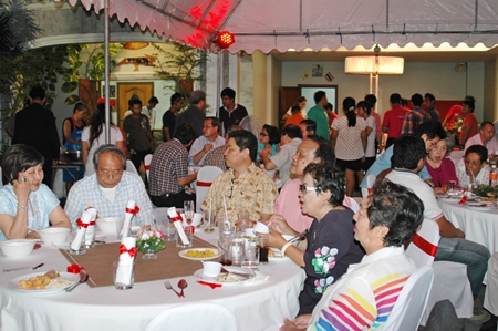 Politicians and honored guests enjoy the birthday party.