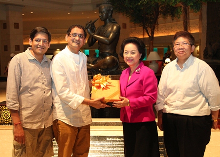After the successful completion of a large-scale, luxury Indian wedding at the Royal Cliff Hotels Group, Mickey Jain received one of the 38 “Friend of Thailand 2013” awards from the Tourism Authority of Thailand (TAT).  In honour of his recognition, Royal Cliff Managing Director Panga Vathanakul (2nd right) presented him with a special gift to commemorate his numerous accomplishments. On hand to witness the presentation was Royal Cliff Director of Operations Vipavee Wutichat (right).
