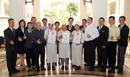 Chatchawal Supachayanont (5th left) GM of the Dusit Thani Pattaya is joined by hotel management in celebrating with the F&B staff who brought home awards from the 2013 Thailand Ultimate Chef Challenge held at the Impact Exhibition and Convention Center. The winners are seen proudly holding up their certificates and medals (left to right): Sununsiri Kamto - Commis II (Bronze Medal for Individual Western Plated Dessert); Juthaporn Dawsawa - Commis II (Gold Medal for Fruit and/or Vegetable Carving) and Khanatsanan Wangsa - Commis I (Bronze Medal for Petits Fours/Pralines). The event was organized by the Thailand Chefs Association and participated in by almost 500 competitors from Thailand, Cambodia, Israel, Myanmar, Taiwan and Turkey.