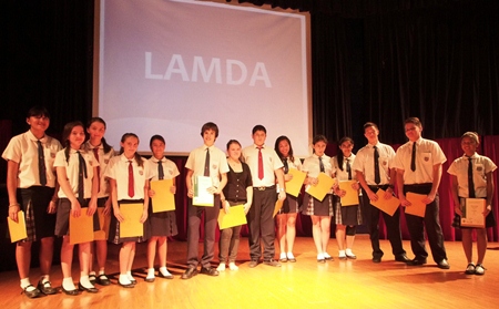 LAMDA students proudly display their certificates.