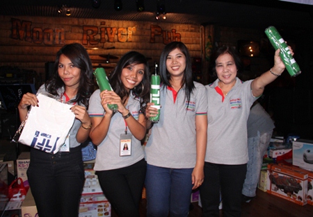 (l-r) Nat and May from the marketing department along with Noi and Aunty Taew from the accounting department show off their prizes for performing well in the night’s first game.