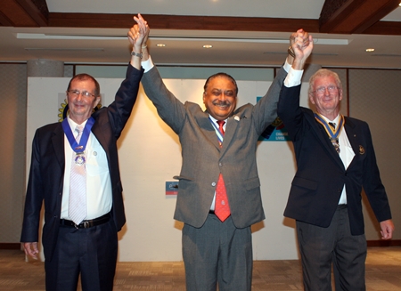 PDG Peter Malhotra proclaims Gerard Porcon (right) as the new president of the Rotary Club Pattaya Marina as Joseph Roy (left) successfully completes his term of office. 