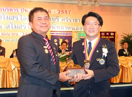 Visit Ekakh (left), member of the Lions Club of Pattaya, is presented a special  plaque of honor for being the outstanding Lions club member this year.  He is receiving the award from Burin Chantharakkarnkha, former president of the Lions Club of Pattaya.