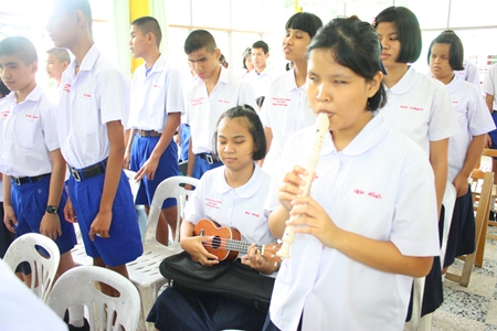 Students singing and playing instruments for the song ‘Amazing Grace’.