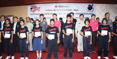 Children show off their card after attending the D.A.R.E project.