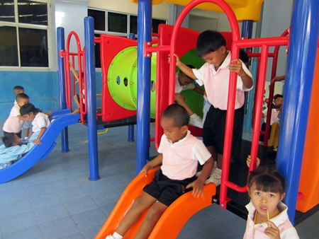 Children at the Triamsuksa Foundation School in Chantaburi enjoy their new playground.