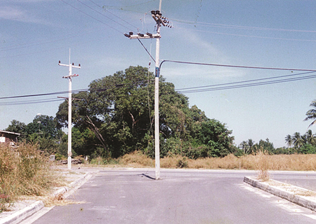 1997 - Stumper of the week?  Why is this pole in the middle of the road?