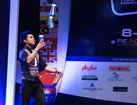 Jarinth Suttiwaja shows off his bartending skills in the Mekong Pattaya Signature Drink Menu Search competition.