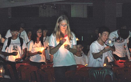 A somber candlelight ceremony caps off the activities in memory of Father Ray.