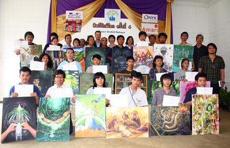 20 students display their prize-winning drawings highlighting environmental conservation, with sponsors and the judging committee at the Amari Orchid Resort & Tower.