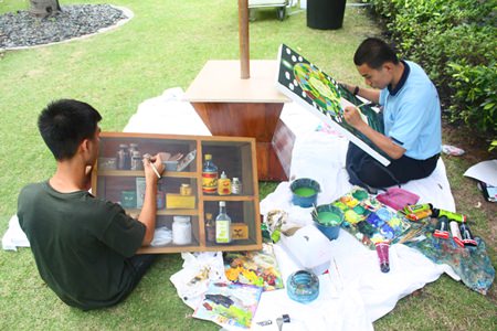 Youths give their masterpieces finishing touches before time ran out to enter them in the 4th Art for the Planet competition.