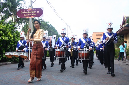 The Pattaya School No. 11 marching band leads the HM the Queen parade in front of Laem Bali Hai.